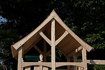 Triumph Play System's kelton deluxe cedar swing set with wood roof.